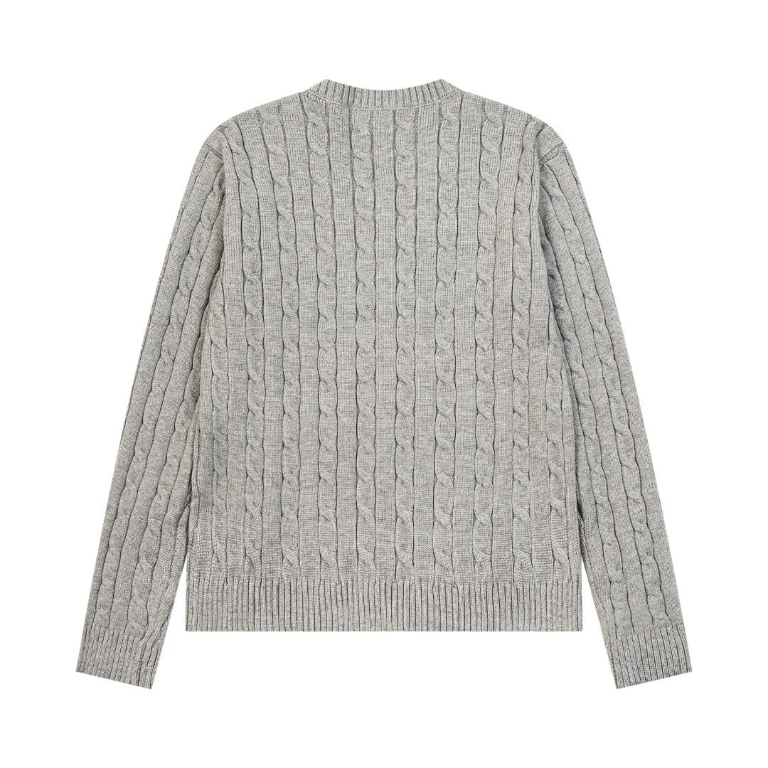V-neck knitted sweater with twist embroidery